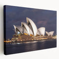 Side view of a large stretched canvas featuring a detailed Sydney skyline in muted blue and gray tones.