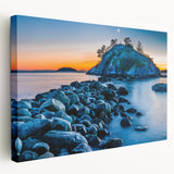 Large wall art of British Columbia scenery on stretched canvas, featuring forest and mountain in muted green and blue tones.