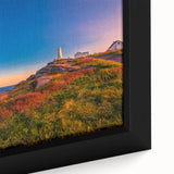 Close-up of a textured black wall art depicting Newfoundland scenery on a framed canvas, with vibrant color accents.