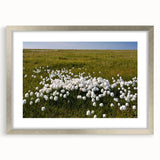 Textured art depicting an abstract scenery of the Northwest Territories in muted earth tones on a framed silver mat.