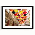 Colorful abstract art print of a textured Quebec scenery in a large black frame, ideal for living room decor.