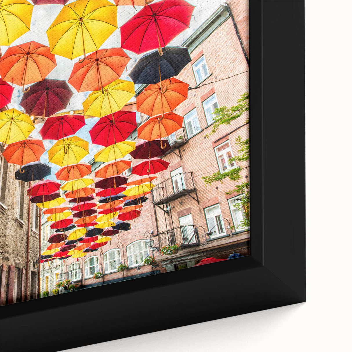 Framed canvas depicting a black textured art scene of Quebec, with vibrant colorful elements.
