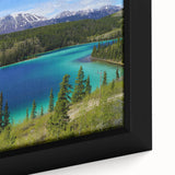 Framed canvas depicting a textured, colorful Yukon scenery in black with vibrant twilight hues, ideal for living room decor.