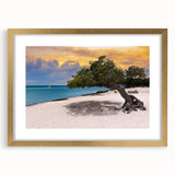 Abstract art print of a Caribbean seascape in blue and turquoise tones, framed in gold, ideal for dining room decor.