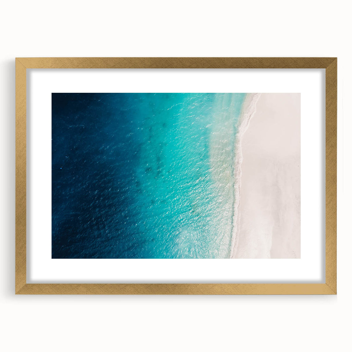 Abstract art print of Caribbean scenery in muted blue and green tones, framed in gold, suitable for dining room decor.