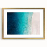 Abstract art print of Caribbean scenery in muted blue and green tones, framed in gold, suitable for dining room decor.
