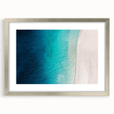Extra large abstract art print of Caribbean scenery in silver frame, featuring textured blue and green hues.