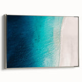 Framed canvas of a vintage-style Caribbean landscape with vibrant blue and green tones, ideal for living room decor.