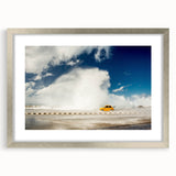 Extra large abstract art print of Caribbean scenery in muted blue and green tones, framed in silver.