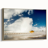 Framed canvas featuring a vintage-style landscape painting of the Caribbean, in muted gold and black tones.