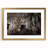 Abstract art print depicting a Caribbean scene in vibrant blue and green tones, framed in gold.