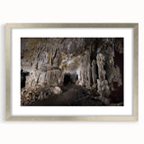 Extra large abstract art print depicting a textured Caribbean scenery in vibrant blue and green, framed with a silver mat.