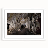 Textured abstract art print depicting a Caribbean scene in vibrant blue and green tones on a framed white canvas.