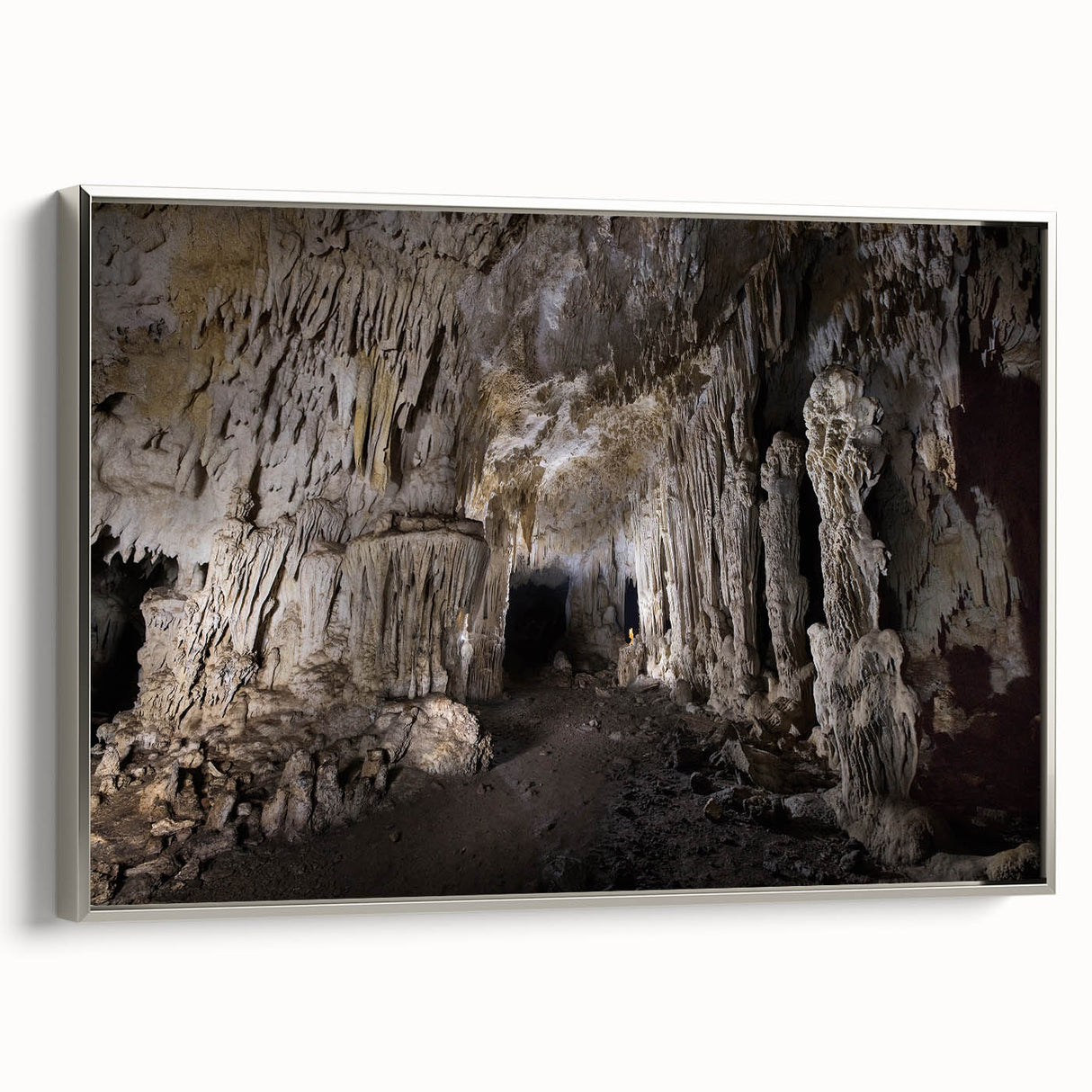 Framed canvas featuring a vintage-style landscape painting of the Caribbean with muted blue and green tones.