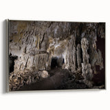 Framed canvas featuring a vintage-style landscape painting of the Caribbean with muted blue and green tones.