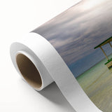 Art Deco style poster of a Caribbean scenery on rolled canvas, with vibrant blue and green hues.