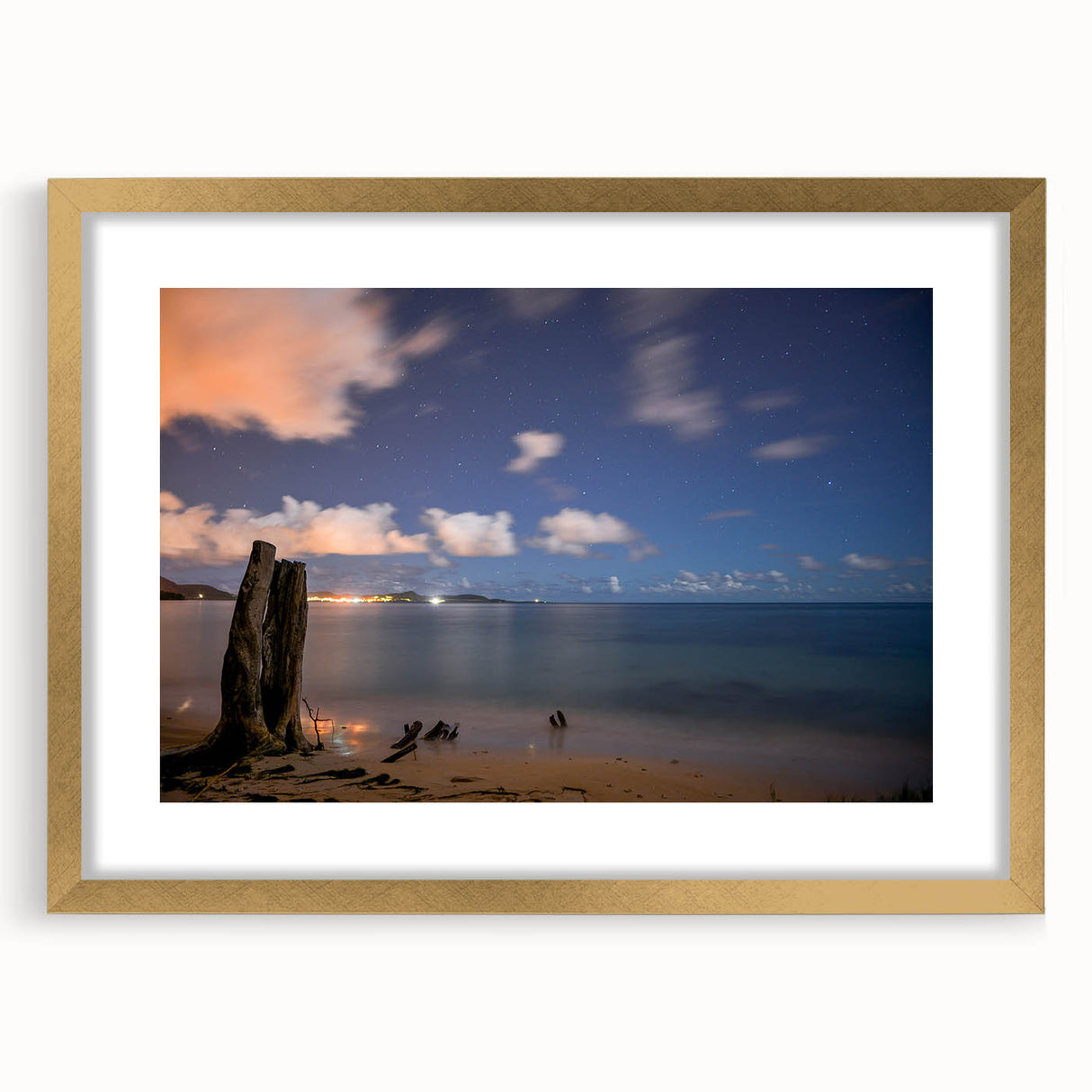 Abstract art print of a Caribbean scenery in muted blue and green tones on a framed canvas, suitable for dining room decor.