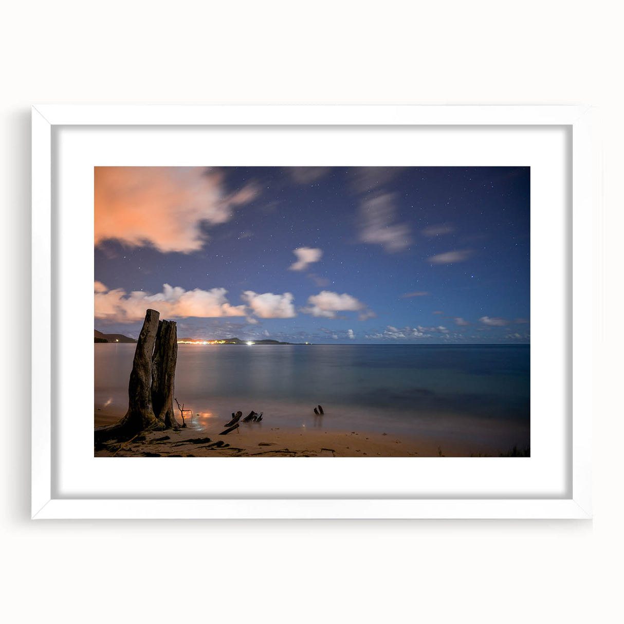 Textured abstract art print of Caribbean scenery in muted blue and green tones on a white framed mat, ideal for bedroom art.