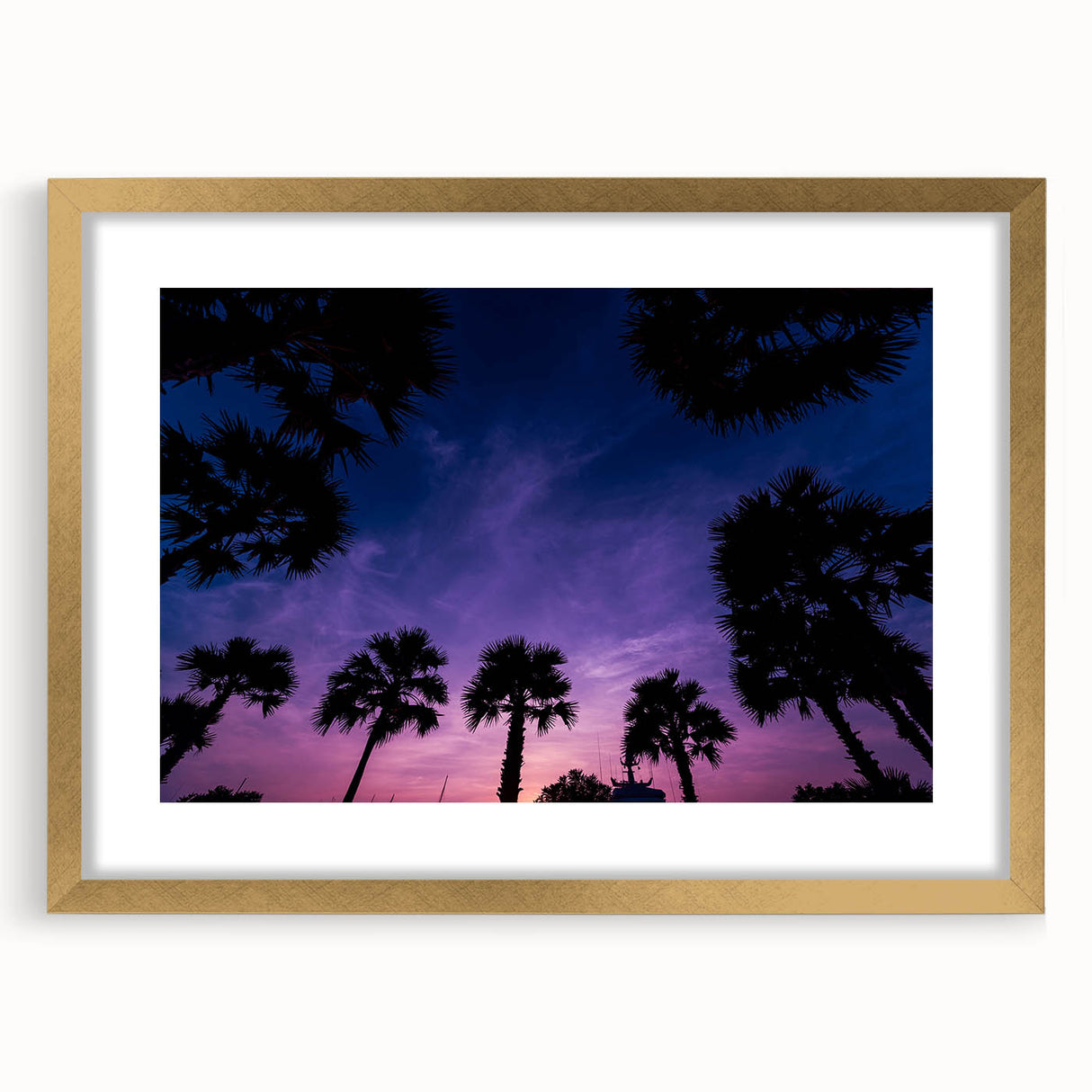 Abstract art print of a Caribbean scenery in muted blue and green tones, framed in gold, ideal for dining room decor.