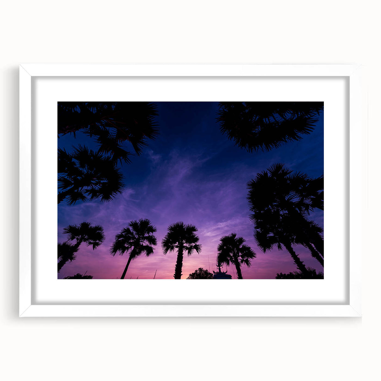 Textured abstract art print of a Caribbean scene in muted blue and green tones, framed with a white mat.