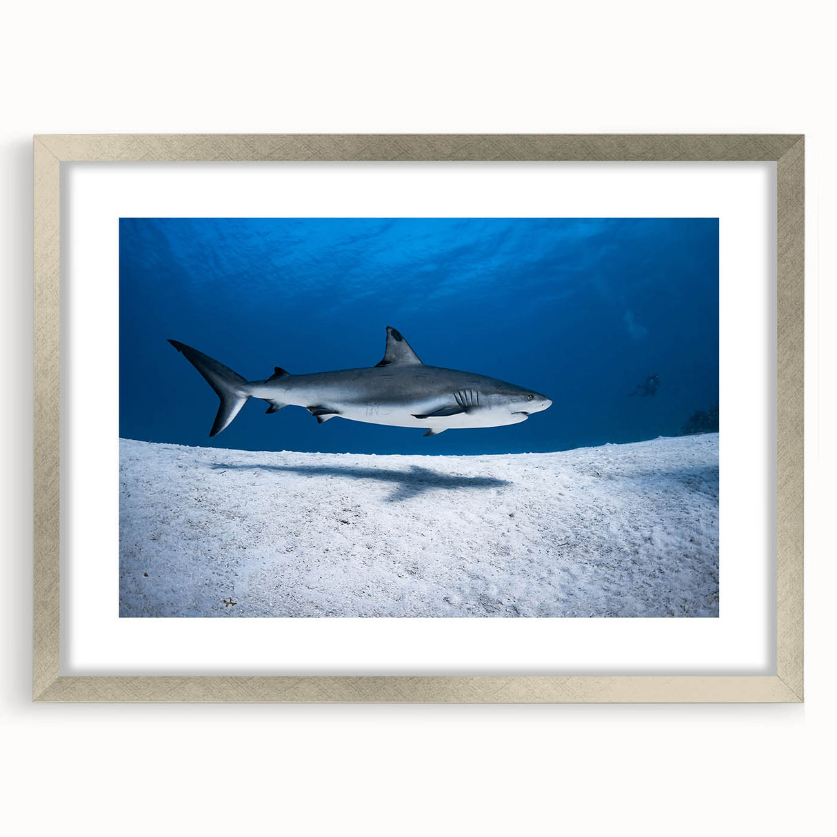 Extra large abstract art print featuring textured Caribbean scenery in muted blue and green tones, framed in silver.