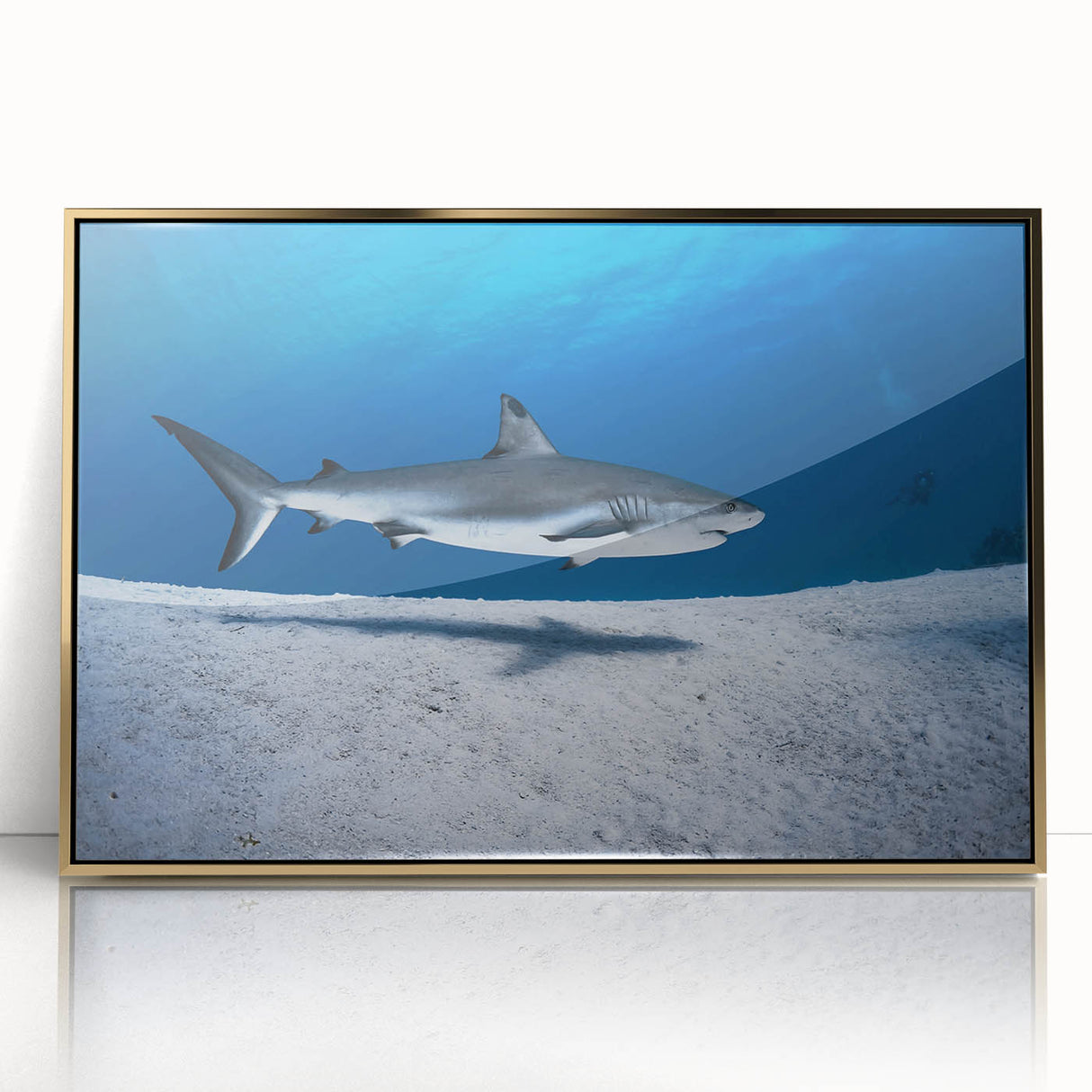 Art Deco poster featuring a Caribbean scenery with turquoise waters and palm trees, framed in gold acrylic.