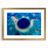Extra large abstract art print of a Central American scenery in gold frame, featuring textured brush strokes in earth tones.