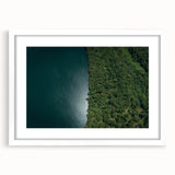 Abstract art print of a lush Costa Rican landscape in vibrant green and blue tones, framed with a white mat.