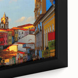 Close-up of a framed canvas depicting a textured, colorful Central American scenery in black, ideal for living room decor.