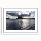 Abstract art print of a Central American landscape in muted earth tones on a framed white mat, ideal for dining room decor.