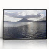 Large abstract wall art depicting a Central American landscape in muted earth tones, framed in black acrylic.