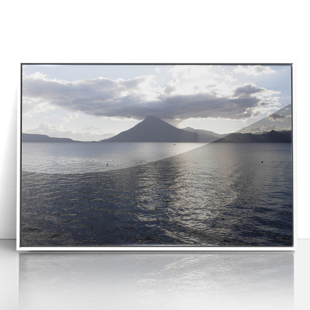 Art deco poster featuring a tranquil Guatemalan landscape in pastel hues, framed in white acrylic.