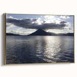 Framed canvas featuring a vintage-style landscape painting of a Guatemalan scenery in muted gold and black tones.