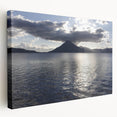 Large stretched canvas depicting a scenic Guatemalan landscape in vibrant greens and blues, ideal for kitchen wall art.