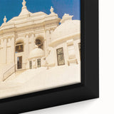 Close-up of a textured black wall art depicting a colorful Central American scenery on a framed canvas.