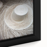 Close-up of a black framed canvas depicting a colorful, textured Central American landscape, ideal for living room decor.