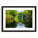 Abstract art print featuring a vibrant, colorful depiction of a European scenery on a large textured canvas, framed in black.