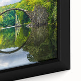 Close-up of a black framed canvas featuring a textured, colorful European scenery.