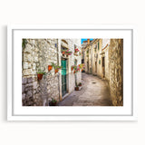 Textured abstract art print of a Croatian landscape in muted earth tones on a framed white mat, ideal for bedroom art.