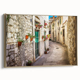 Framed canvas featuring a vintage-style landscape painting of a Croatian scene in muted gold and black.