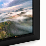 Extra large framed canvas featuring a textured depiction of a European scenery in black with colorful accents.