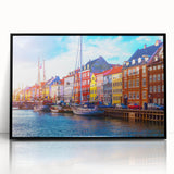 Large abstract wall art depicting a European scenery in muted earth tones on a framed acrylic.