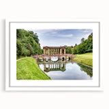 Textured art print of an abstract European cityscape in muted earth tones, framed with a white mat.