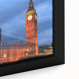 Close-up of black wall art featuring a textured depiction of Big Ben with colorful accents on a framed canvas.