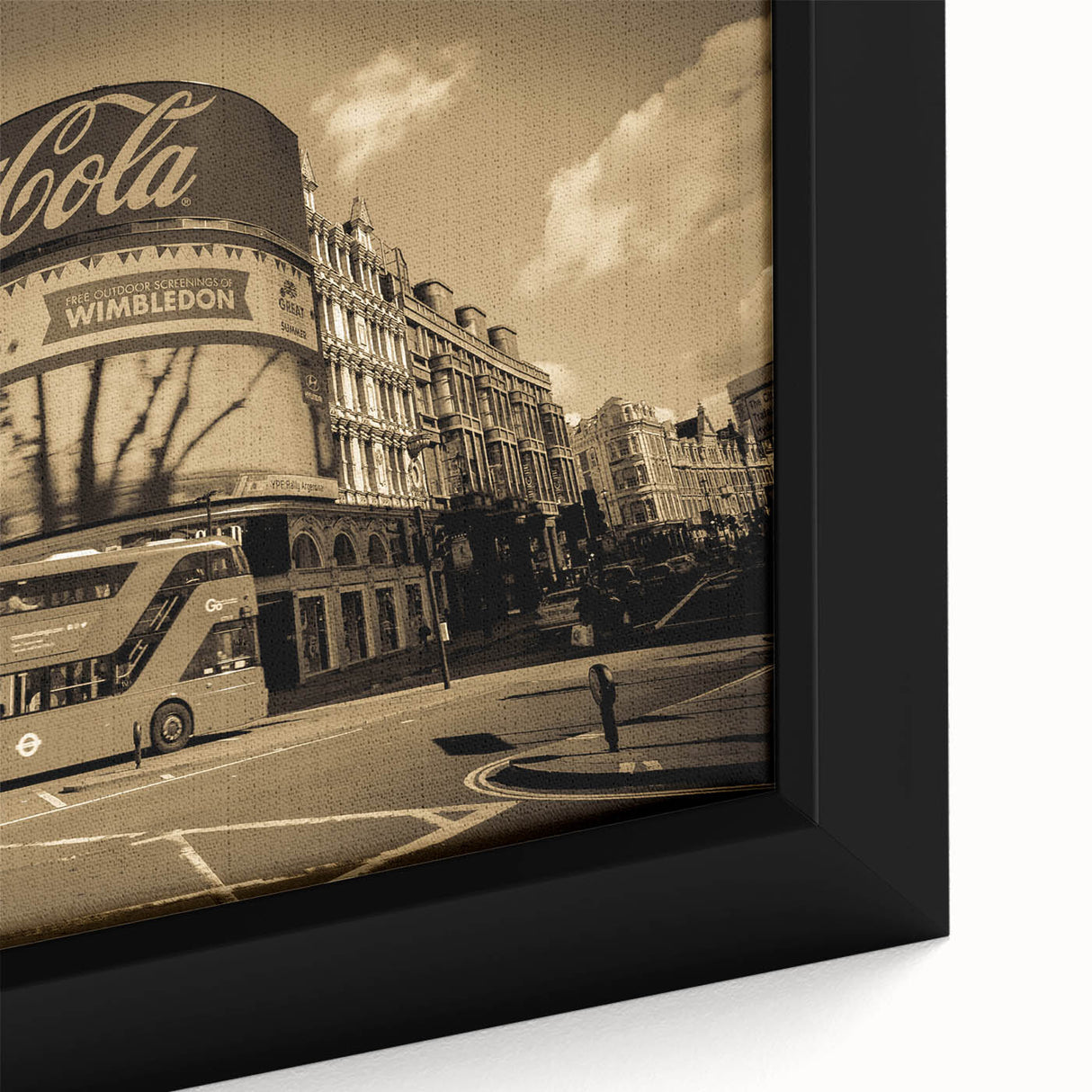 Close-up of a textured black wall art depicting Piccadilly, England, with colorful accents on a framed canvas.
