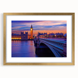 Abstract art print of the Thames River, featuring muted blues and grays, in a gold frame with mat.