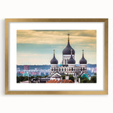 Abstract art print of a European landscape in muted earth tones, framed in gold, suitable for dining room decor.