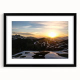 Abstract art print of the French Alps in vibrant colors on a large framed canvas, ideal for living room decor.