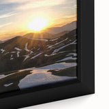 Black wall art featuring a textured close-up of the French Alps with vibrant, colorful accents on a framed canvas.