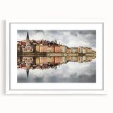 Textured abstract art print of Lyon scenery in muted earth tones on a framed white mat, suitable for bedroom decor.